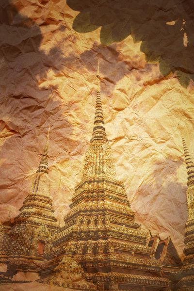 تصویر رترو معبد شیطان تایلندی در پس زمینه کاغذی قدیمی نسخه نورپردازی ناهموار گرانج جزء طراحی