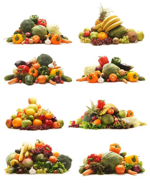 بسیاری از میوه ها و سبزیجات مختلف جدا شده روی سفید