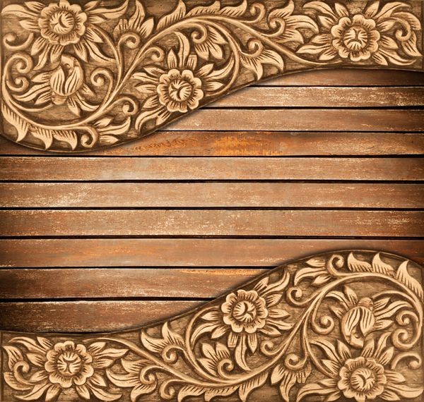 الگوی حکاکی گل با قاب چوبی در زمینه چوب