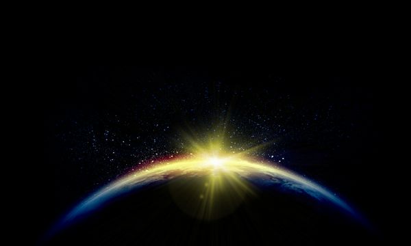 سیاره زمین با ظاهر شدن نور پرتو خورشید طلوع یا غروب خورشید