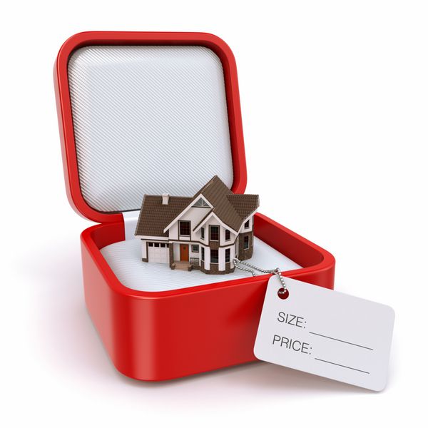 جعبه هدیه با خانه مفهوم املاک و مستغلات