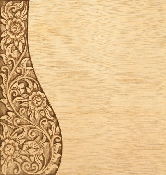 الگوی حکاکی گل با قاب چوبی در زمینه چوب