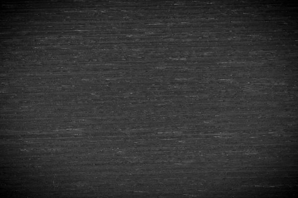 بافت پس‌زمینه کلوزآپ چوبی سیاه و سفید با طرح تصویر