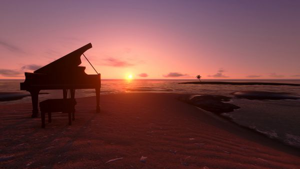 پیانو در ساحل در غروب آفتاب
