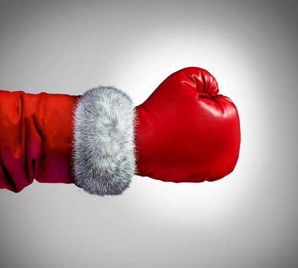 مفهوم دستکش بوکس بابا نوئل به عنوان یک مفهوم تجاری تعطیلات برای خرید مشتریان رقابتی بعد از کریسمس برای فروش و سود
