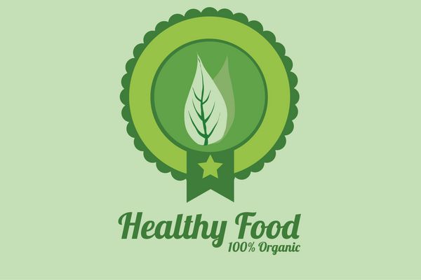 تصاویر غذای سالم برچسب دایره ای با یک برگ روی پس زمینه سبز رنگ