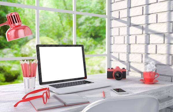 تصویر سه بعدی لپ تاپ و وسایل کار روی میز نزدیک دیوار آجری محل کار