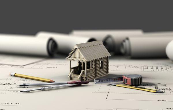 ابزار معمار و خانه چوبی روی ورق های نقشه ها تصویر سه بعدی