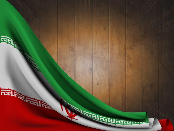 پرچم ایران روی میز چوبی با فلاش نور