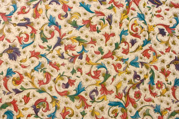 قطعه ای از الگوی نساجی ملیله رترو رنگارنگ با تزئینات گلدار که به عنوان پس زمینه مفید است