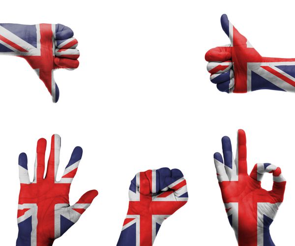 مجموعه ای از دست ها با حرکات مختلف که در پرچم بریتانیا پیچیده شده است