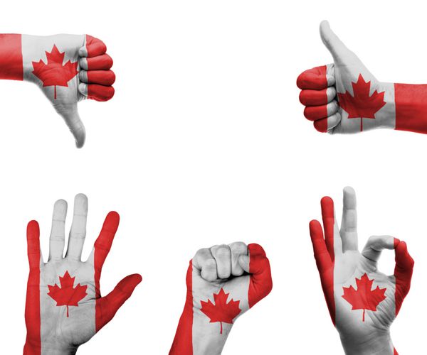 مجموعه ای از دست ها با حرکات مختلف در پرچم کانادا پیچیده شده است
