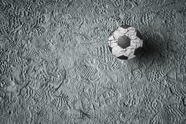 توپ فوتبال روی زمین با نقش کفش