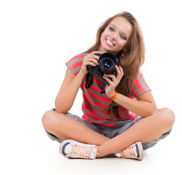 دختر نوجوان با دوربین حرفه ای po جدا شده روی سفید