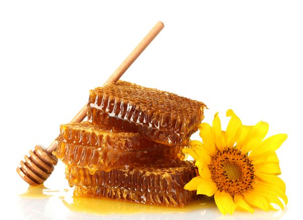 لانه زنبوری شیرین با عسل آب ریز چوبی و آفتابگردان جدا شده روی سفید