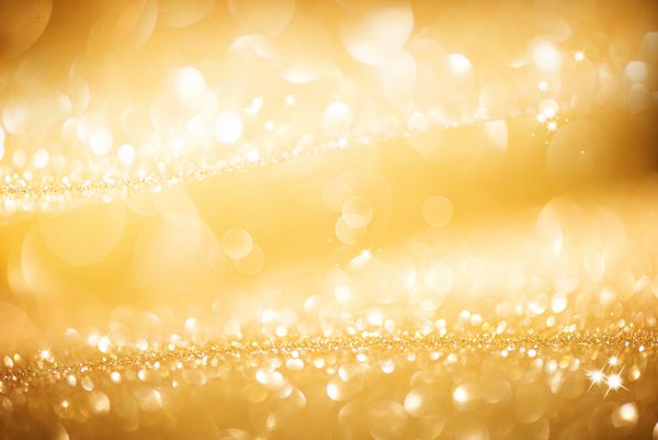 پس زمینه طلای کریسمس پس‌زمینه‌ی پر زرق و برق انتزاعی طلایی و درخشان با ستاره‌های چشمک زن بوکه تار