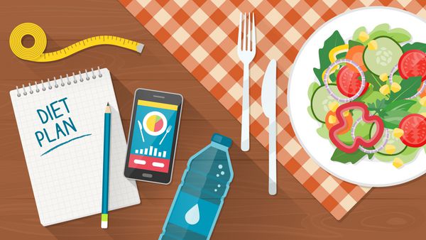 بنر غذا رژیم غذایی سبک زندگی سالم و کاهش وزن با ظرف سالاد ست سفره گوشی هوشمند و برنامه رژیم غذایی روی دفترچه یادداشت