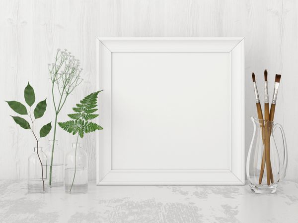 ماکت پوستر مربعی داخلی با قاب خالی برس های هنری و گیاهان در بطری ها در پس زمینه دیوار سفید رندر سه بعدی