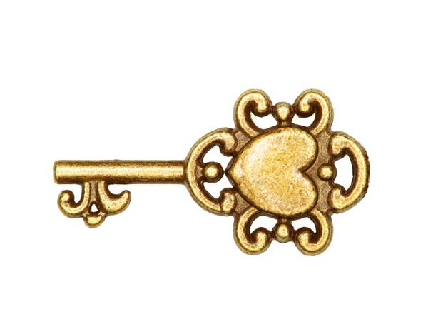 کلید طلایی جدا شده روی سفید
