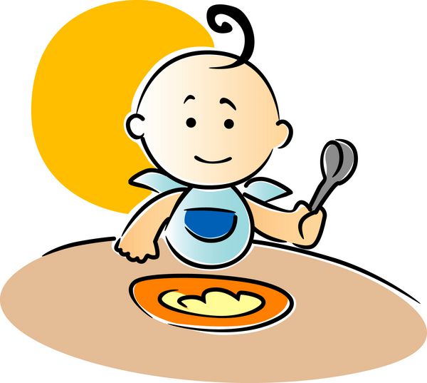 بچه کوچولوی ناز نشسته در حال خوردن غذا