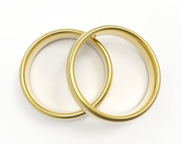 حلقه های طلایی جدا شده در زمینه سفید حلقه ازدواج رندر سه بعدی نمای بالا
