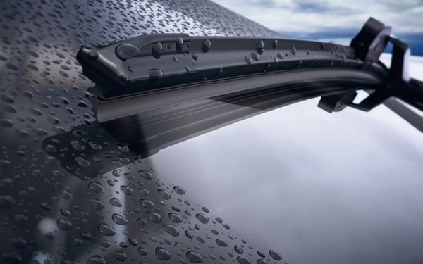 شیشه جلو اتومبیل با قطرات باران و تیغه برف پاک کن بدون قاب از نزدیک رندر سه بعدی