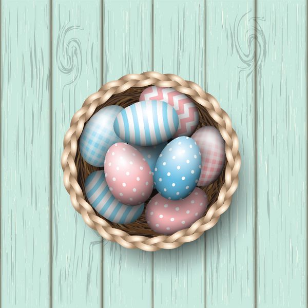 سبد با تخم‌مرغ‌های عید پاک روی پس‌زمینه چوبی آبی تصویر