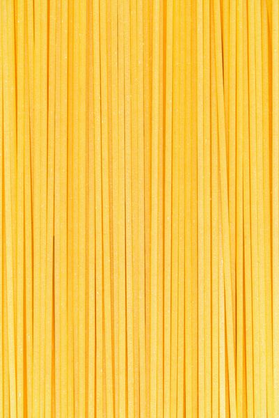 ماکارونی ماکارونی ماکارونی یا اسپاگتی ایتالیایی مواد غذایی خام پس زمینه یا بافت نزدیک