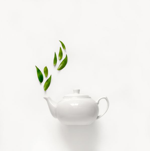 چای سبز چای سبز با برگ های سبز بالا مفهوم ویژگی های چای معطر