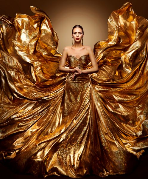 لباس طلای زن پرواز مدل مد در طناب طلایی لباس طلسم پارچه پرواز مانند بال پرتره زیبایی هنر