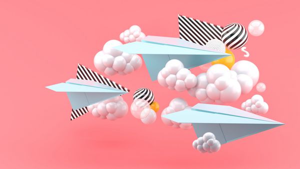 هواپیما کاغذی آبی در میان ابرها بر روی پس زمینه صورتی 3D رندر