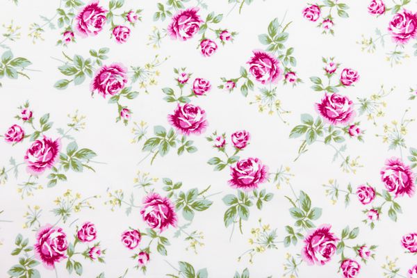 قطعه از الگوی پارچه ای رنگارنگ یکپارچهسازی با پوشش گیوتین با گل های تزئینی مفید به عنوان پس زمینه