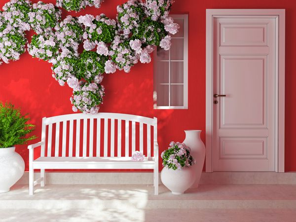 نمایش جلو از یک درب سفید چوبی در یک خانه قرمز با پنجره گل های زیبا و نیمکت در حیاط بیرون خانه