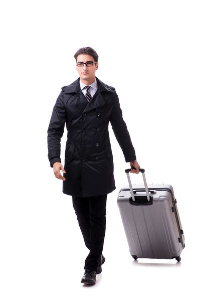 تاجر جوان با چمدان آماده سفر سفری به رنگ سفید است