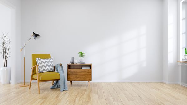 طبقه متوسط ​​مدرن و داخلی مینیمالیستی اتاق نشیمن صندلی زرد با میز چوبی روی دیوار سفید و کف چوبی رندر سه بعدی