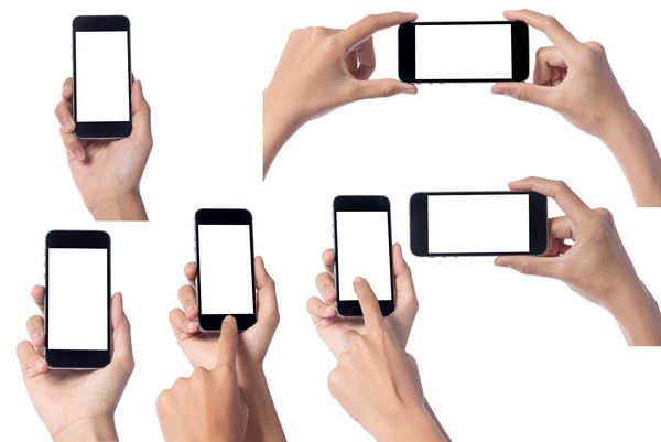 دست زن که دارای صفحه نمایش تلفن های هوشمند مدرن و صفحه نمایش لمسی تلفن همراه جدا شده در پس زمینه سفید است