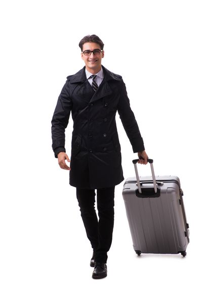 تاجر جوان با چمدان آماده سفر سفری به رنگ سفید است