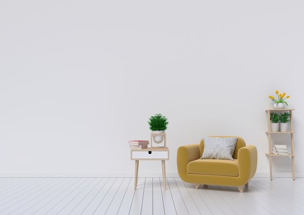 اتاق نشیمن با صندلی پارچه ای زرد کتاب و گیاهان بر روی زمینه دیوار خالی سفید رندر سه بعدی