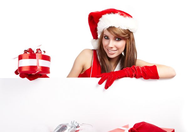 زن زیبا کریسمس در کلاه سانتا که دارای تخته خالی است