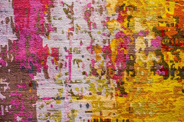 طرح پارچه فرش انتزاعی رنگارنگ به عنوان بافت پس زمینه