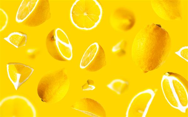 لیموهای پرنده آبدار در پس زمینه زرد مفهوم غذای خلاقانه میوه های ارگانیک گرمسیری مرکبات ویتامین C لیمو به طور کامل و ورقه شده پس زمینه میوه روشن مینیمالیستی تابستانی الگوی لیمو