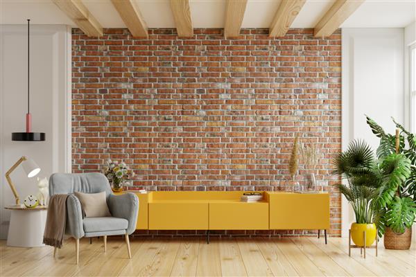 تلویزیون کابینت زرد در اتاق نشیمن مدرن با صندلی راحتی و گیاه روی پس زمینه دیوار آجری رندر سه بعدی