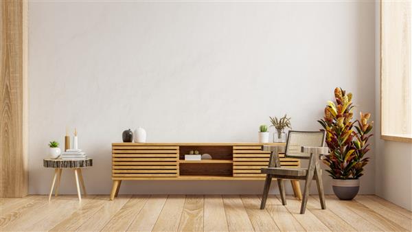 کابینت برای تلویزیون در اتاق نشیمن مدرن با صندلی و گیاه در پس زمینه دیوار سفید رندر سه بعدی