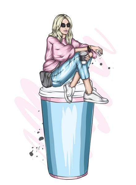 یک دختر زیبا با لباس های شیک در یک لیوان بزرگ قهوه نشسته است مد و استایل لباس و اکسسوری