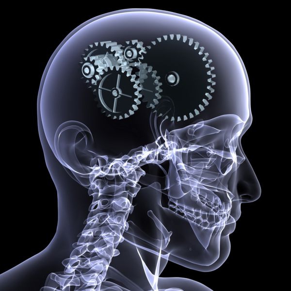 نمای نزدیک اشعه ایکس از سر اسکلت مرد با یک سری چرخ دنده برای مفهوم فکر تک و تنها مانده با پیشینه ی سیاه