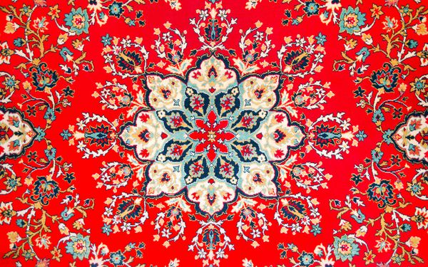 تکه ای از عکس فرش قدیمی شرق پس زمینه به سبک فارسی است