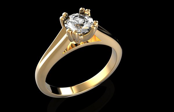 حلقه ازدواج با الماس در زمینه مشکی نشانه عشق