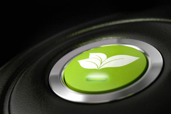 دکمه سبز خودرو سازگار با محیط زیست با پیکتوگرام برگها و نماد نور مصرف سوخت