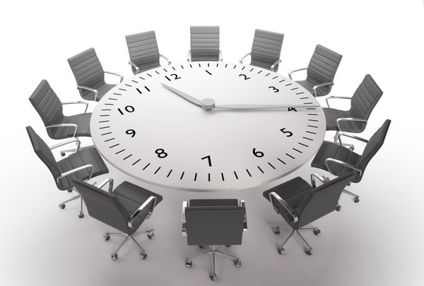 زمان جلسه - میز گرد با صفحه ساعت بزرگ