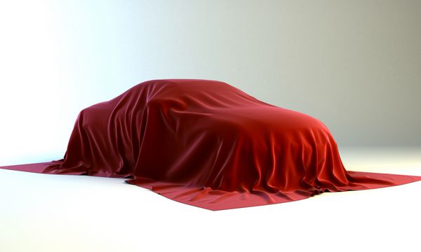 ارائه ماشین جدید - خودرویی که با پارچه قرمز پوشانده شده است